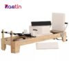Small white bed Pilates workouts with slide track